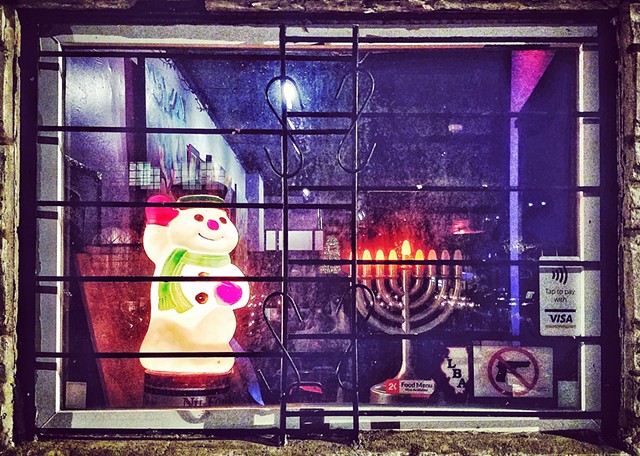 Store window with snowman and menorah