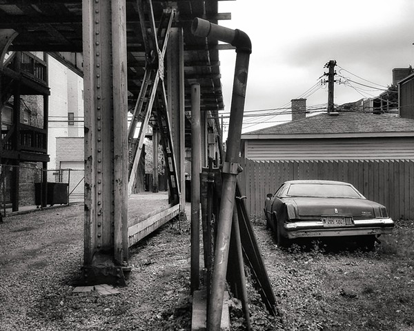 Under the tracks with an old Oldsmobile