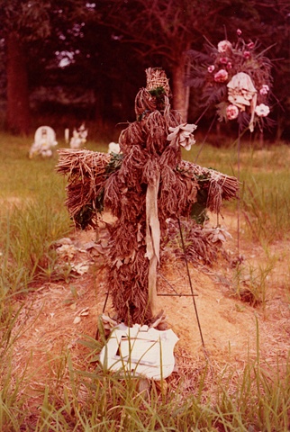 UNTITLED (FADED FLORAL CROSS IN CEMETERY)