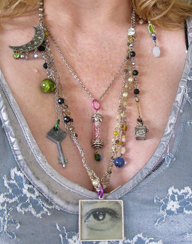 Whimsical, fun, metaphysical necklace with lenticular blinking seeing eye, fairy dust, magic, guiding guardian angel