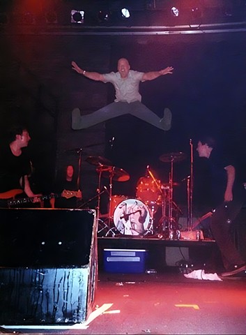 Kevin March of Guided by Voices does a high jump kick off his drum kit