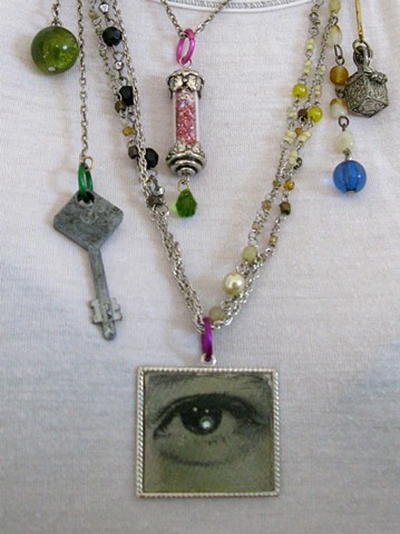 Whimsical, fun, metaphysical, mysterious repurposed upscaled necklace with an antique lenticular blinking seeing eye.