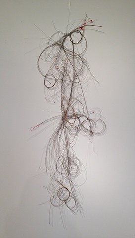 Wall sculpture created from discarded guitar strings, courtesy of Balkun Guitar shop.