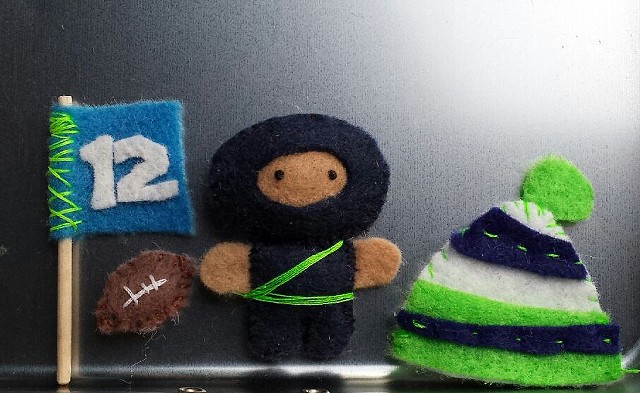 12th man ninja super fan equipped w magnetic football, flag and cozy hat.