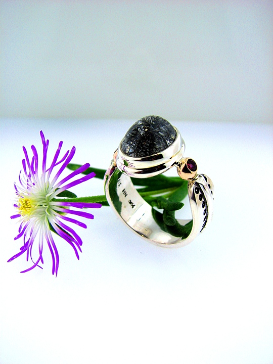 2-Tone sterling silver + 14k yellow gold fabricated ring with 10x12mm oval select Tourmalinated Quartz and 2.5mm Blazing Red Topaz accents.