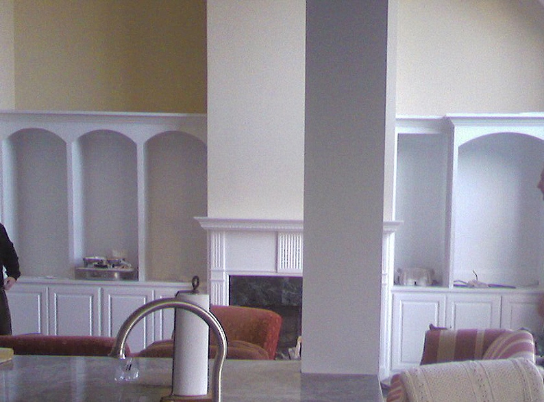 Before photograph showing mantle and kitchen pier to be painted